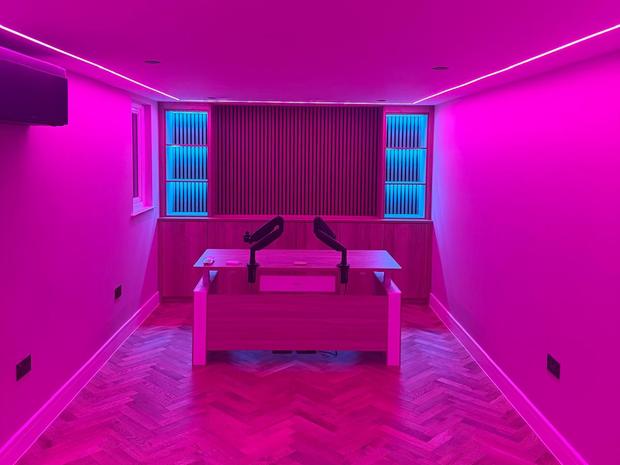 Room lit by a colour changing LED channel around the ceiling perimeter